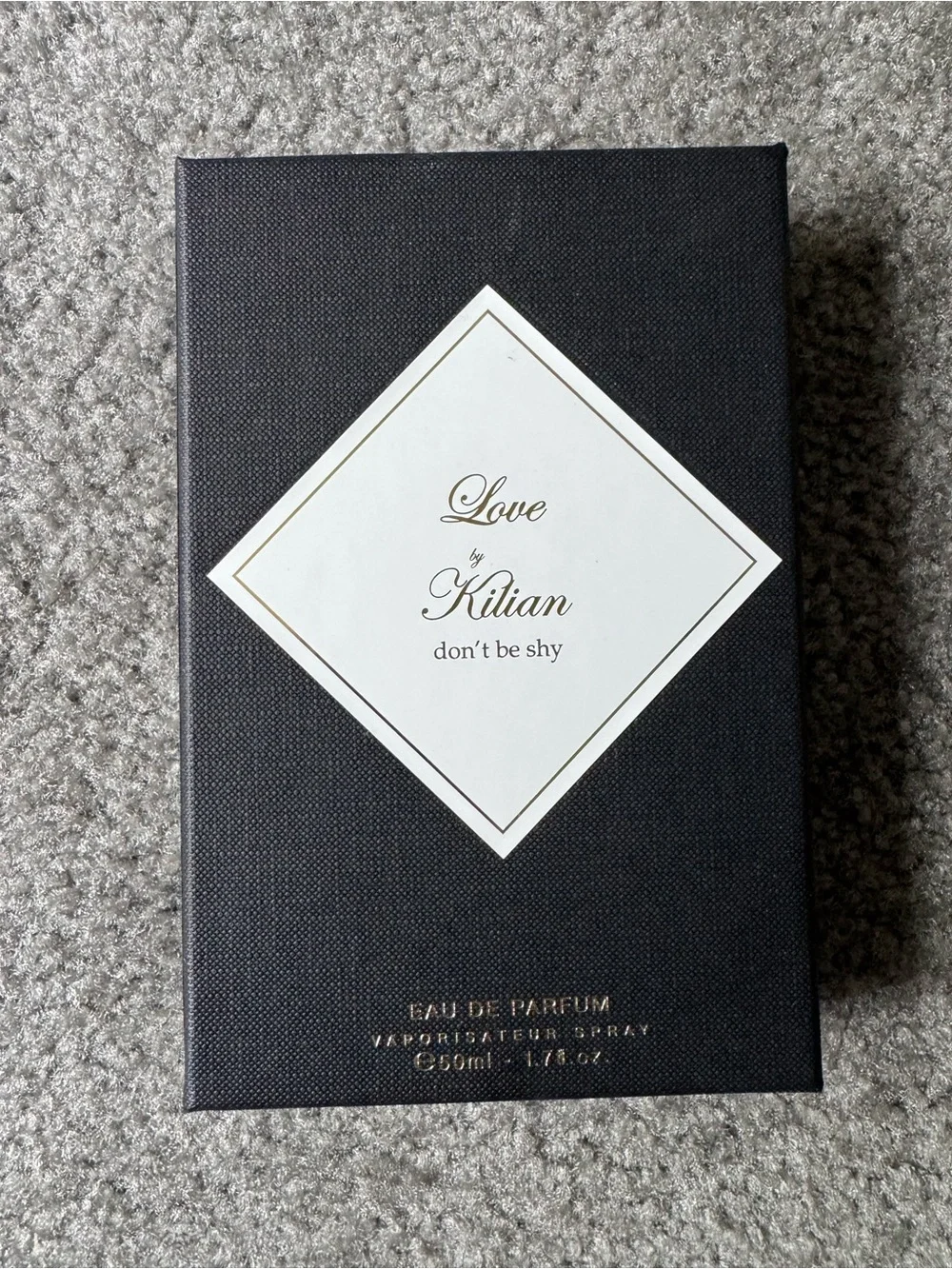 Gucci, Kilian, and Kate Spade boxes